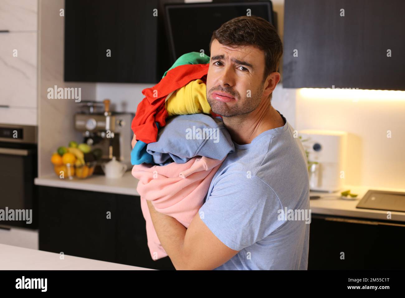 Cute man doing the laundry Stock Photo