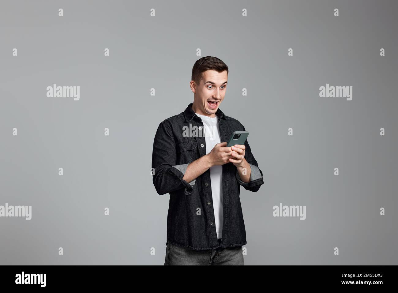 handsome man with mobile cell phone surfing internet Stock Photo
