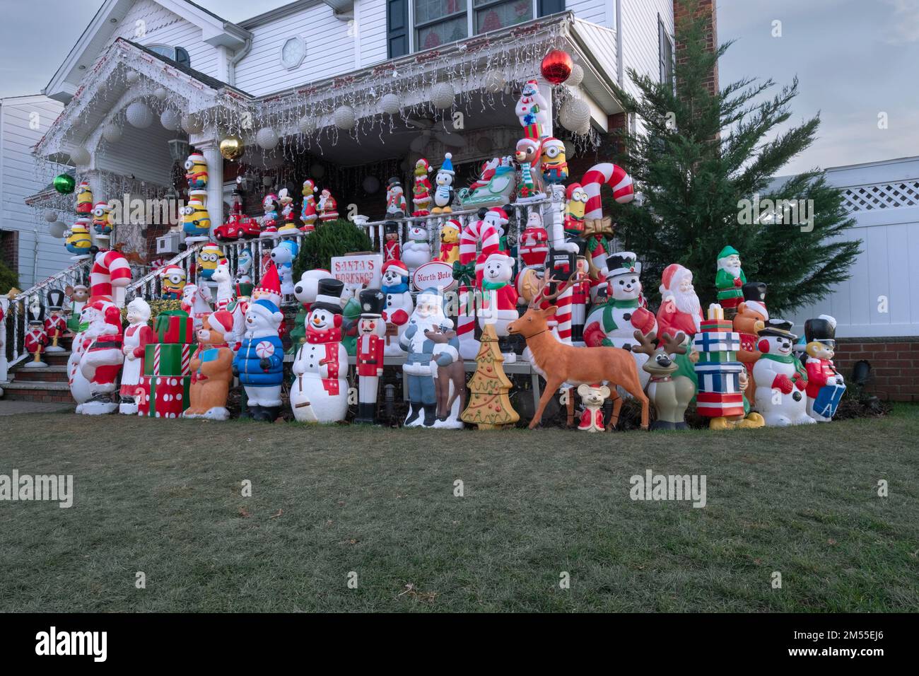 A house decorated for Christmas with over 100 statues on the front lawn