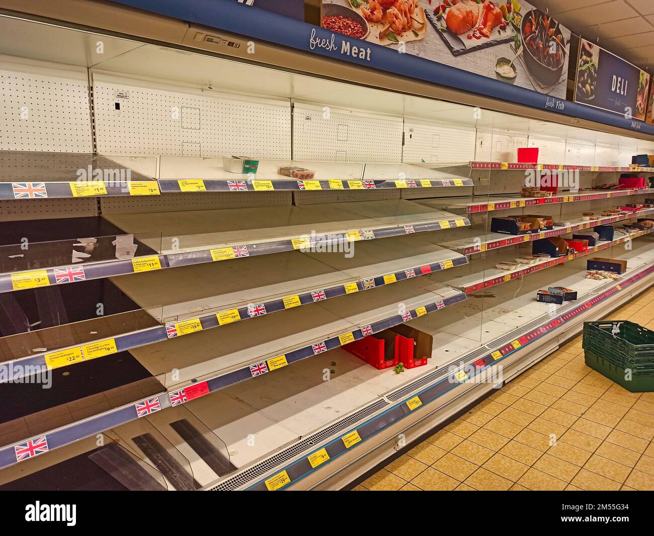 Empty shelves in a high street supermarket. These shelves would normally be stocked full of