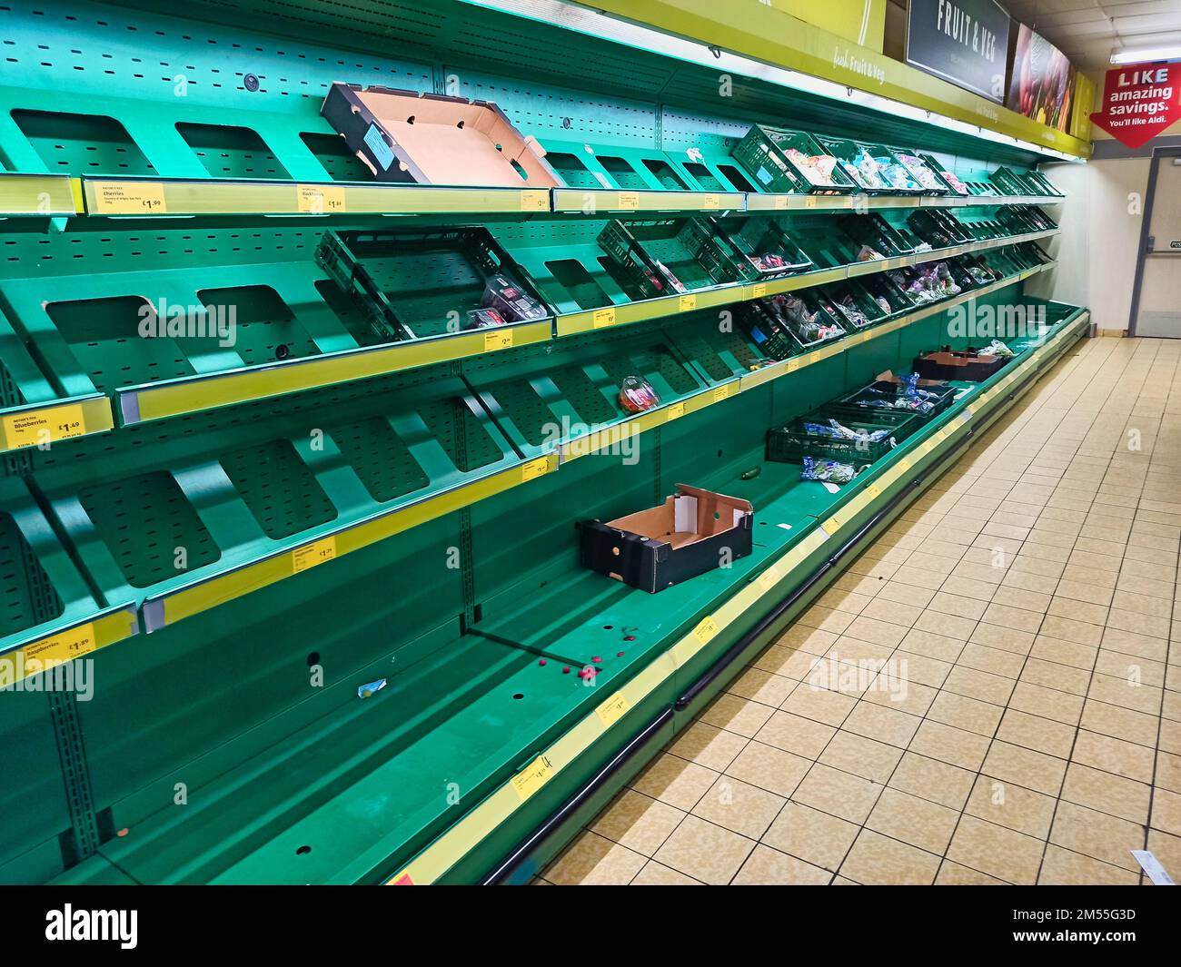 Empty shelves in a high street supermarket. These shelves would normally be stocked full of