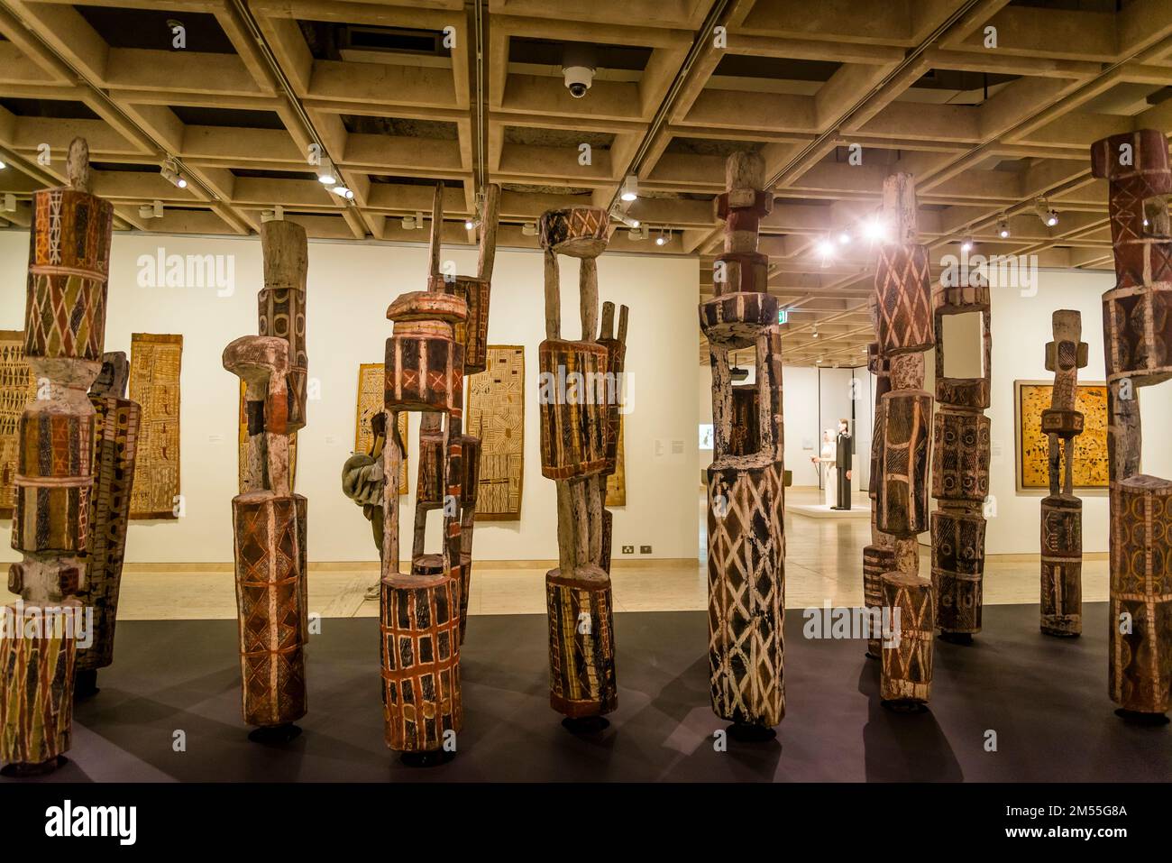 Aboriginal Art - decorated hollow log coffins also known as memorial poles, dupun, ḻarrakit in The Art Gallery of New South Wales, Sydney, NSW, Austra Stock Photo