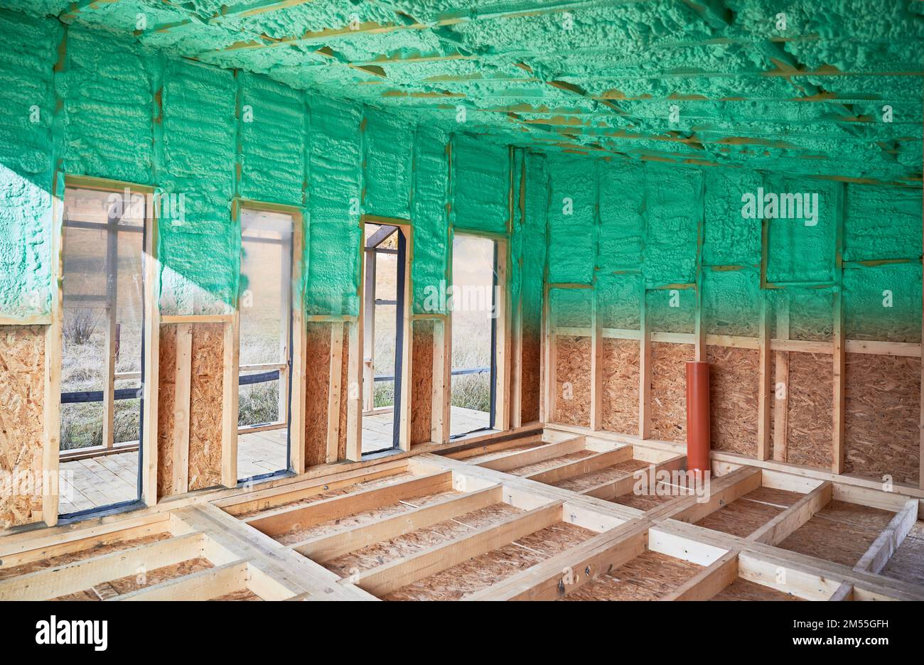 Photo collage before and after thermal insulation room in wooden frame house in Scandinavian style barnhouse. Comparison of walls sprayed by polyurethane foam. Construction and insulation concept. Stock Photo