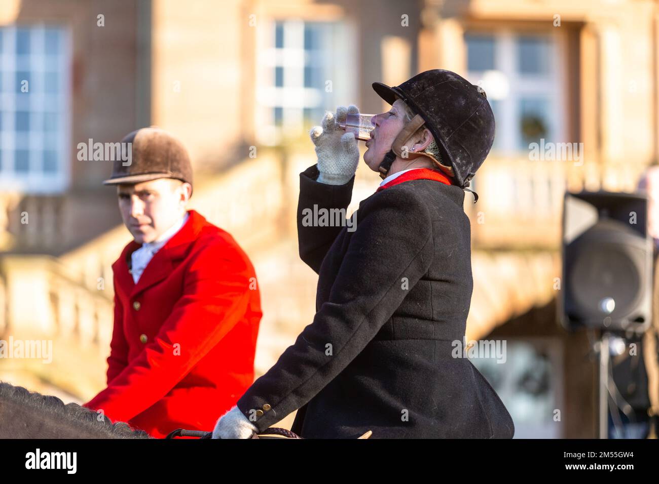 Hagley, Worcestershire, UK. 26th Dec, 2022. A lady rider sips a sherry at the Albrighton and Woodland Hunt as they meet for the traditional Boxing Day hunt at Hagley Hall. Worcestershire, on a bright and sunny day. Credit: Peter Lopeman/Alamy Live News Stock Photo