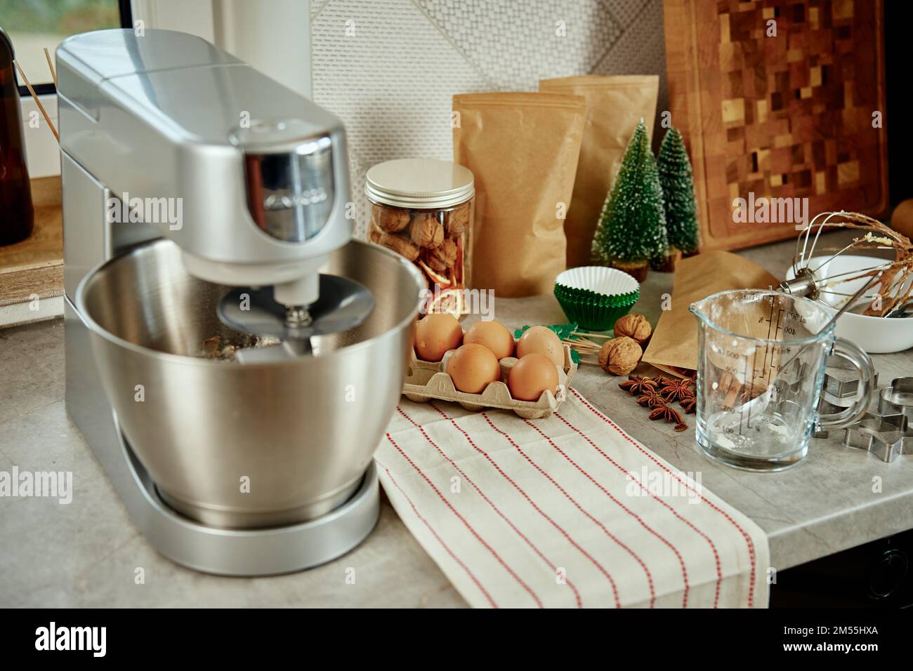 Preparation of dough in an electric mixer at home. Professional mixer