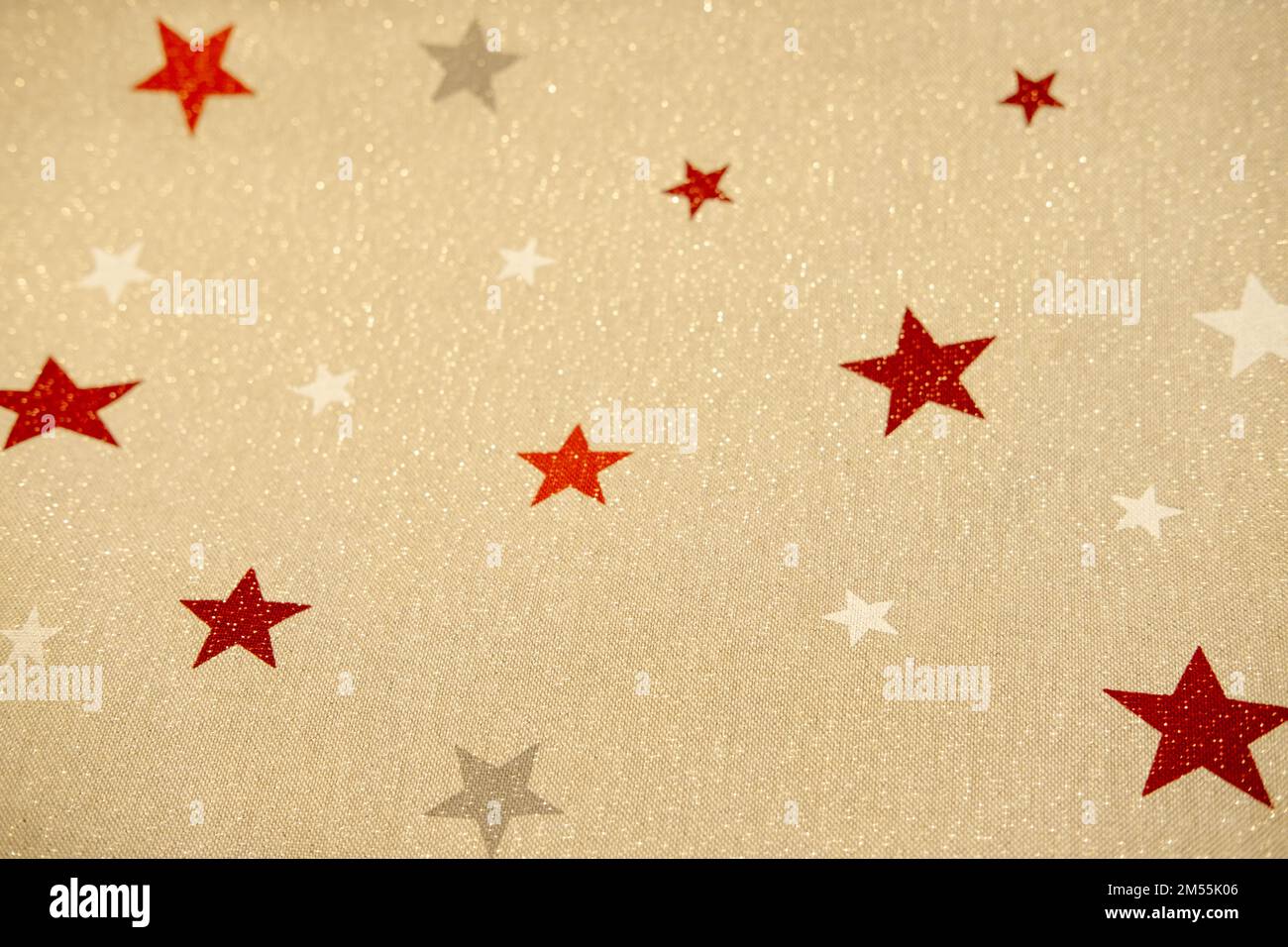 Beige natural fabric sequins and stars. Christmas background Stock Photo