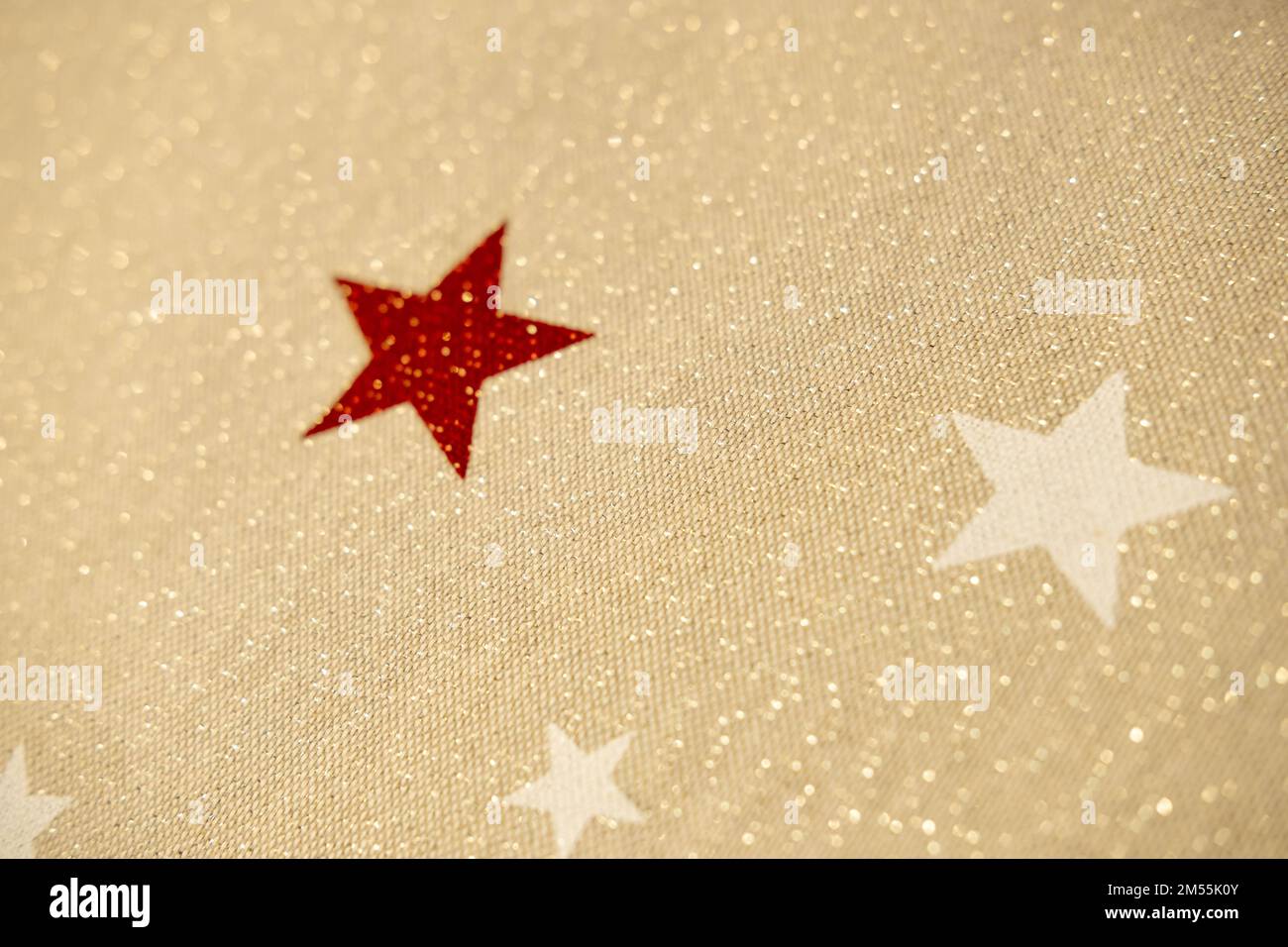 Beige natural fabric sequins and stars. Christmas background Stock Photo