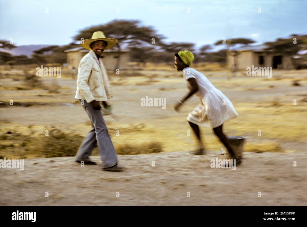 Ethiopia, 1970s, Adami Tulu, man with hat having fun with a young woman, after sunset, Oromia region, East Africa, Stock Photo