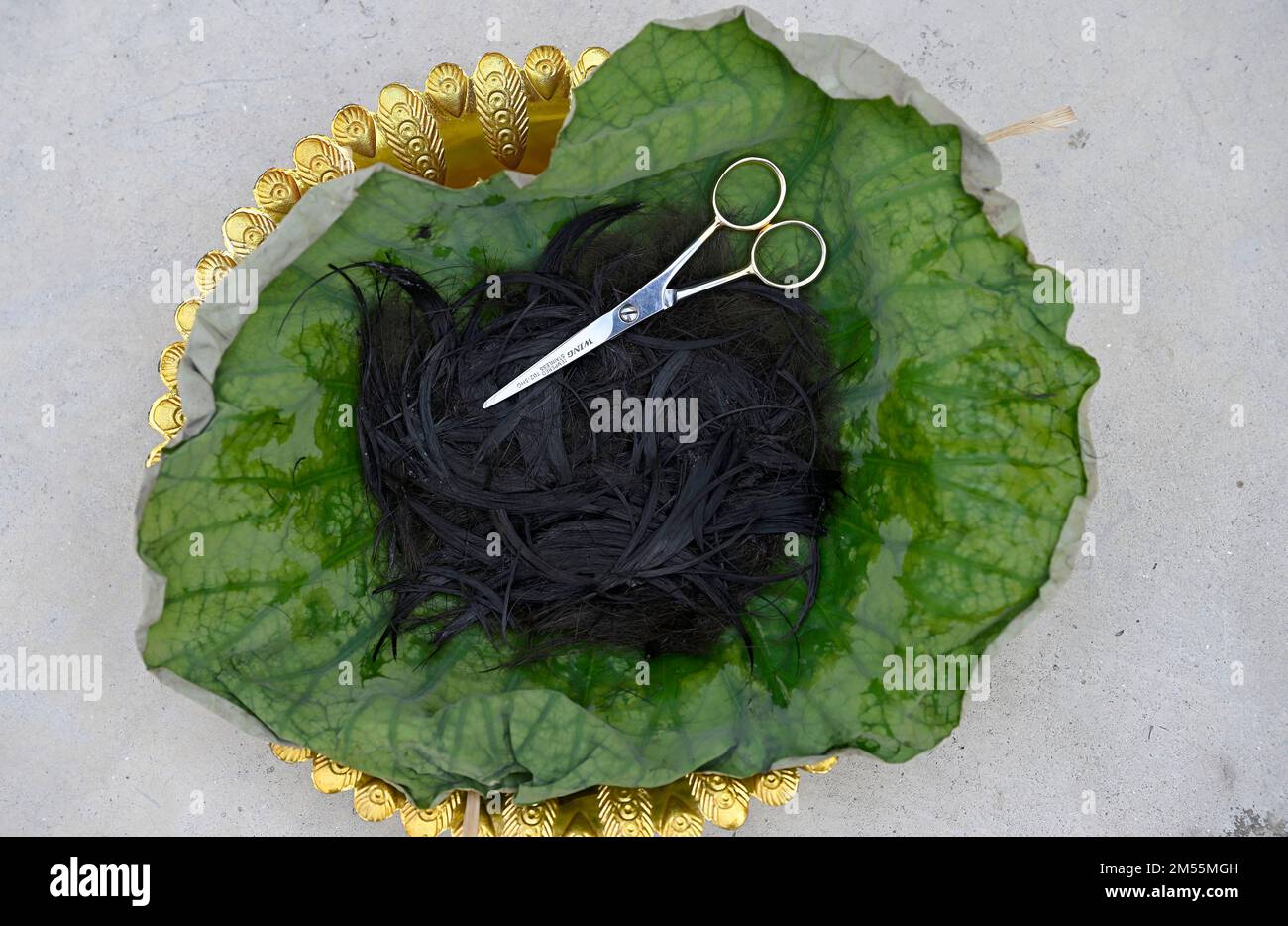 22year old ½ Thai ½ American William “Kai” Bicknell's hair wrapped in a