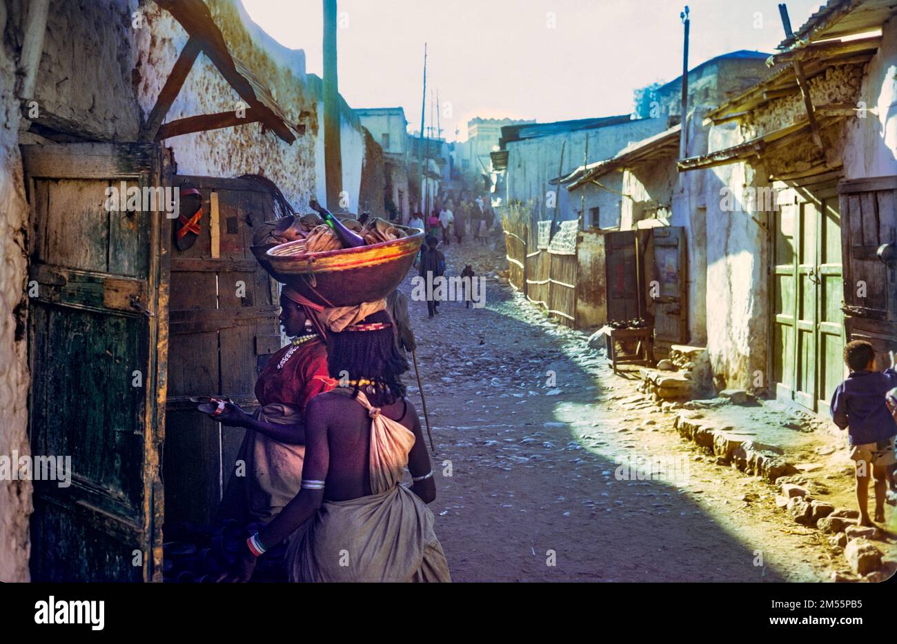 Ethiopia, 1970s, Harar, shopping lane, women carrying baskets on their heads, Harari region, East Africa, Stock Photo