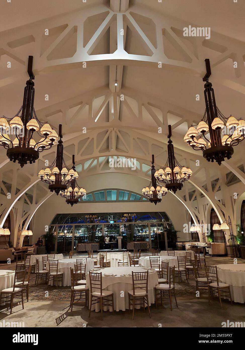 The interior of Fullerton Hotel, Singapore with chandeliers hanging on ...