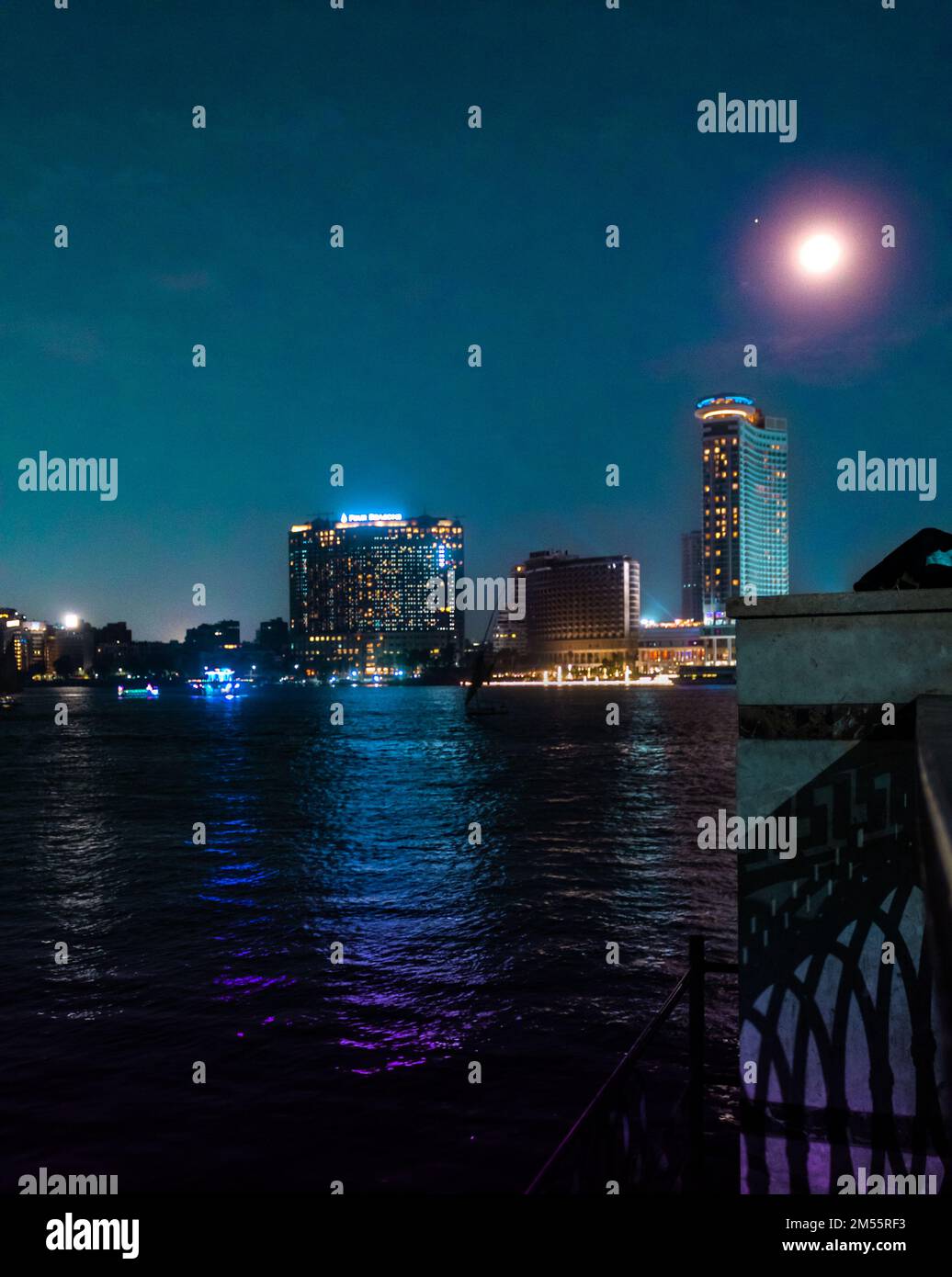 river Nile in Egypt night lights, neon lights reflected on Nile water