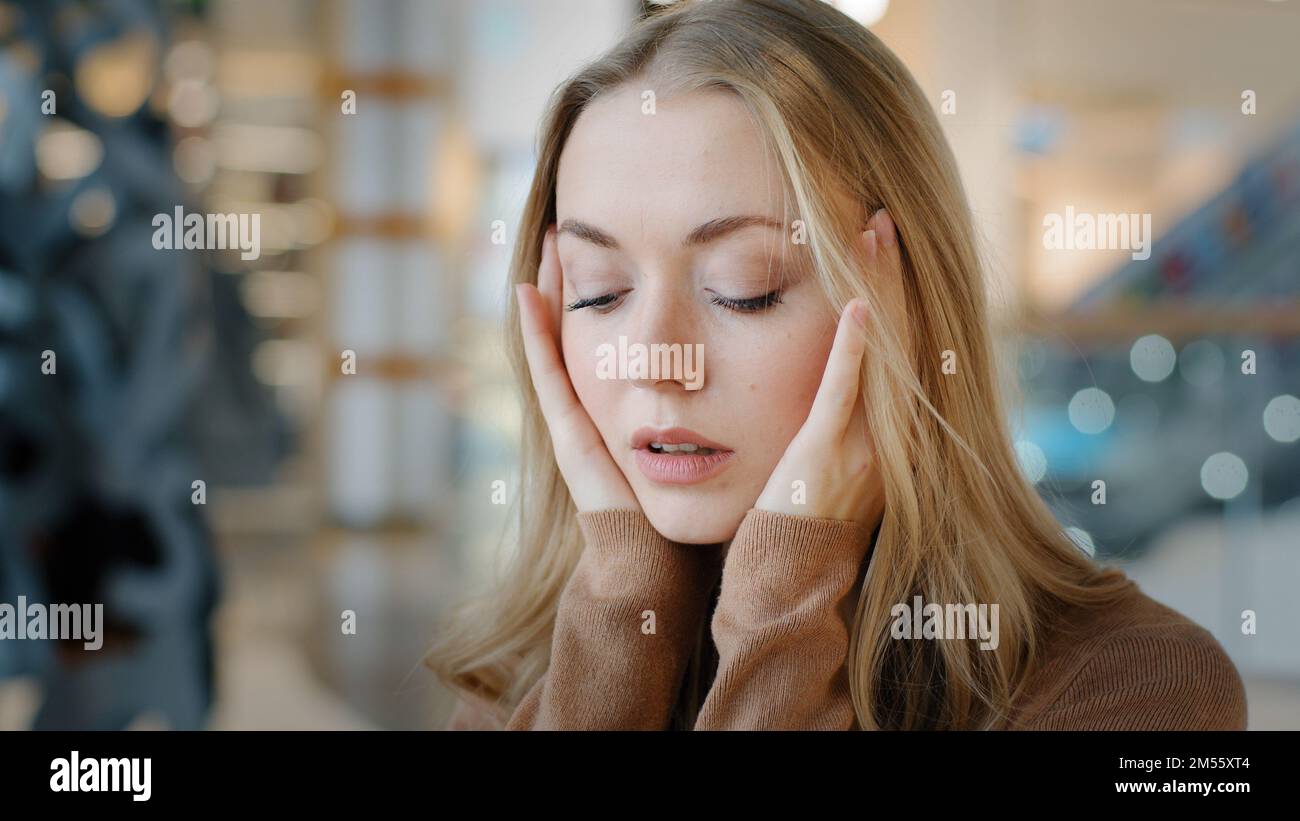 Portrait caucasian frightened stressed worried woman feeling stress worry girl suffer unwell fever headache panic attack problems breaking up Stock Photo