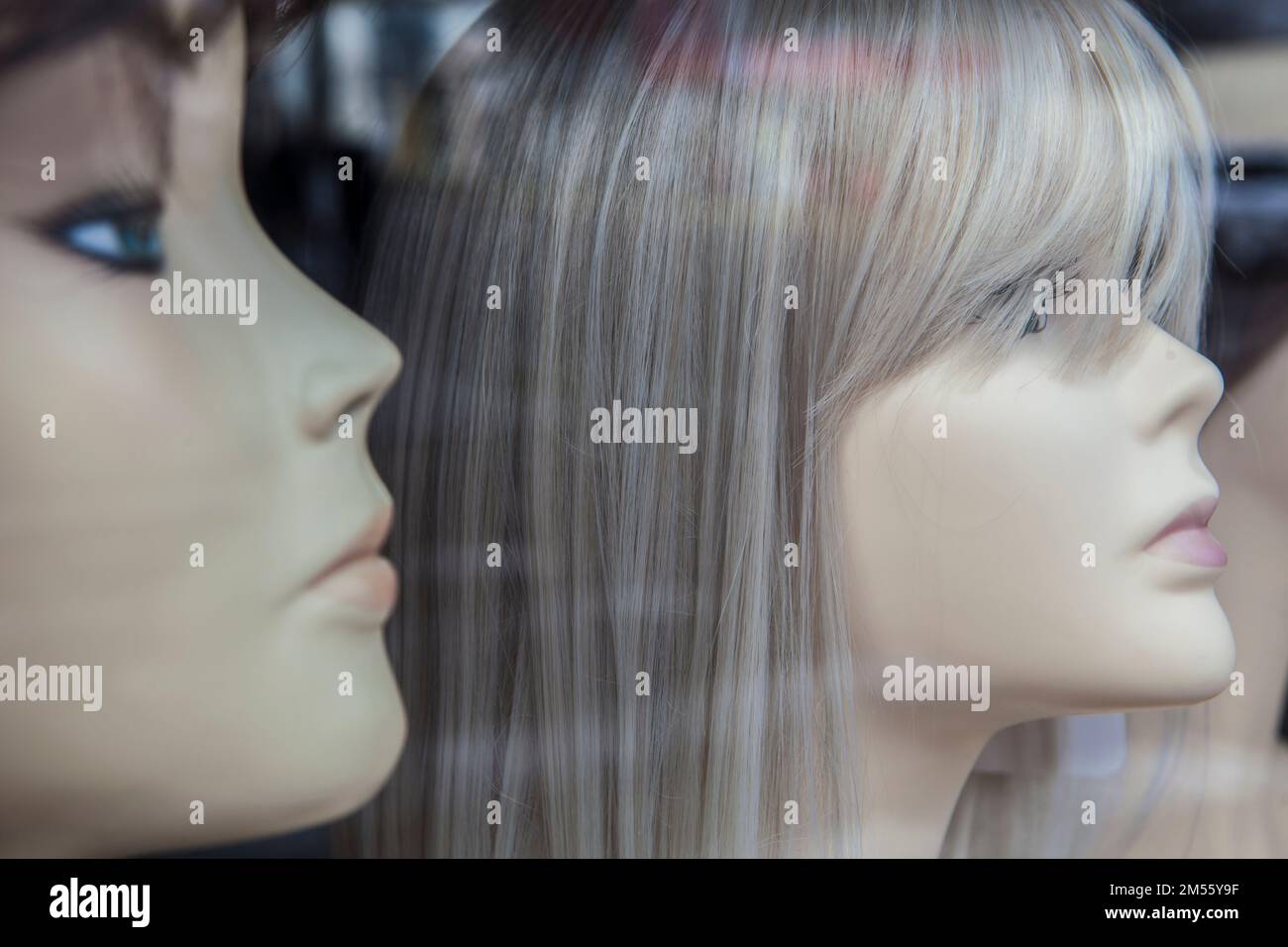 Wigs shop mannequins display. Wigs increases the wearers self-confidence and self-esteem Stock Photo