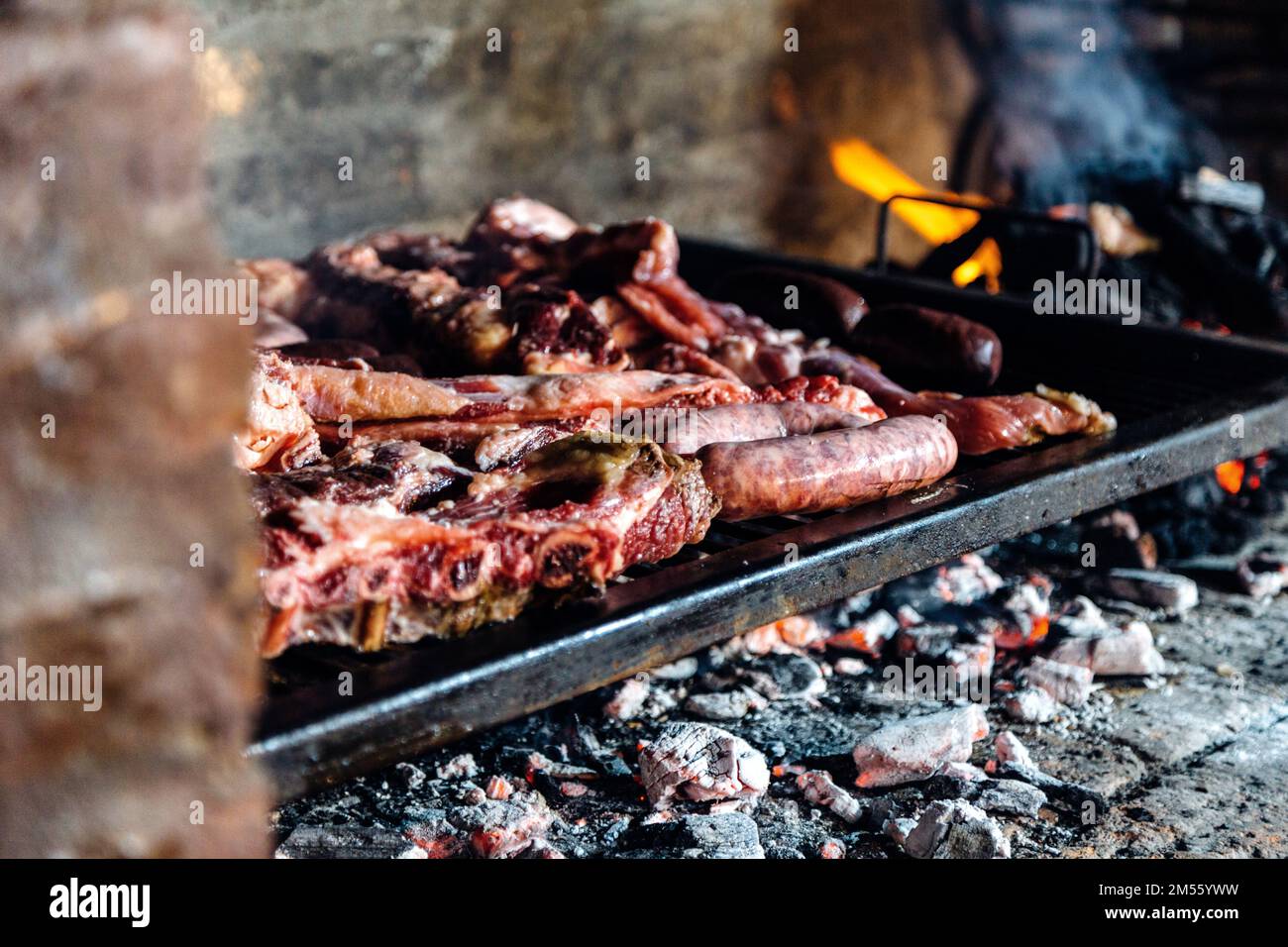 Barbeque, bbq meat cooking on grill. Traditional Asado of Argentina,  Paraguay y Uruguay Stock Photo - Alamy, image size:1300x956