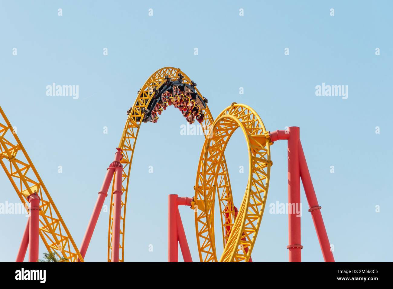 Roller coaster up down turn and a passing loop feint, spiral train of trolleys tends to go down Stock Photo
