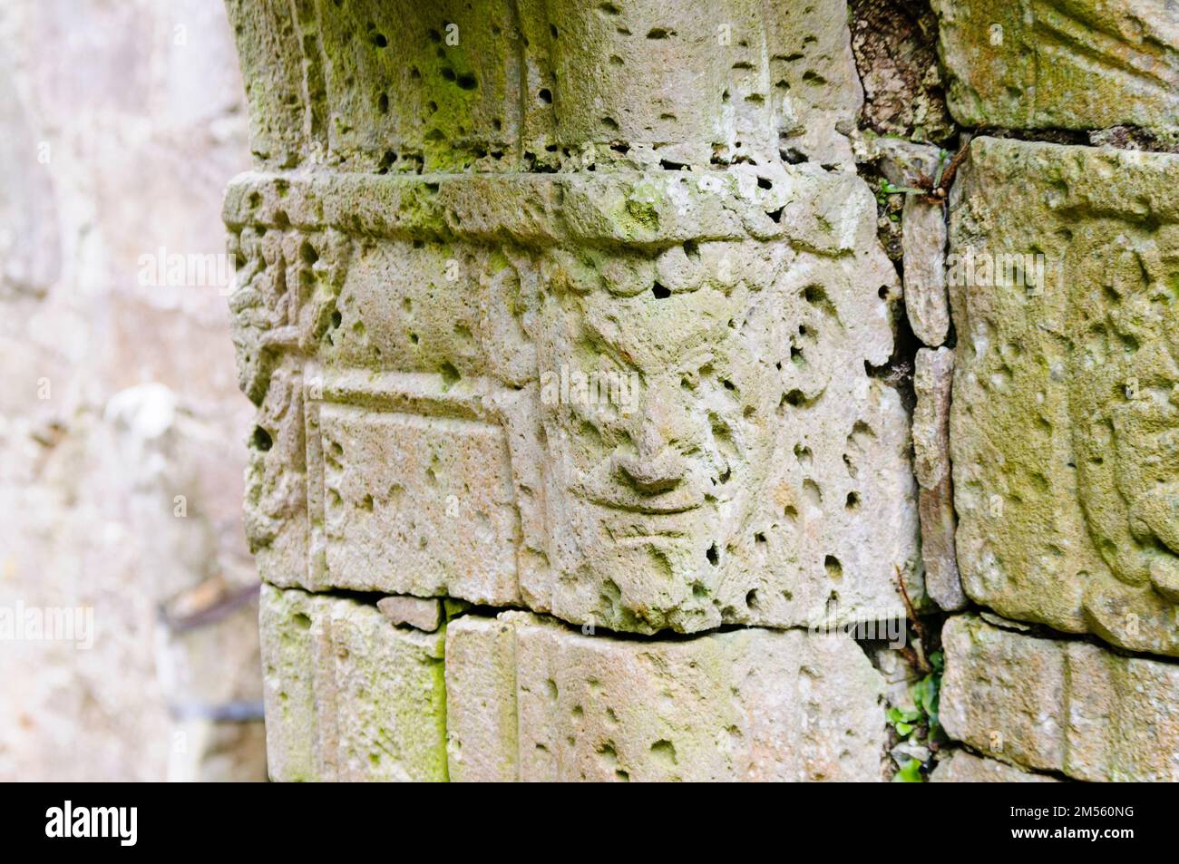 Carved face on a door jamb of the medieval church on Inchagoill Island, Lough Corrib, Republic of Ireland Stock Photo