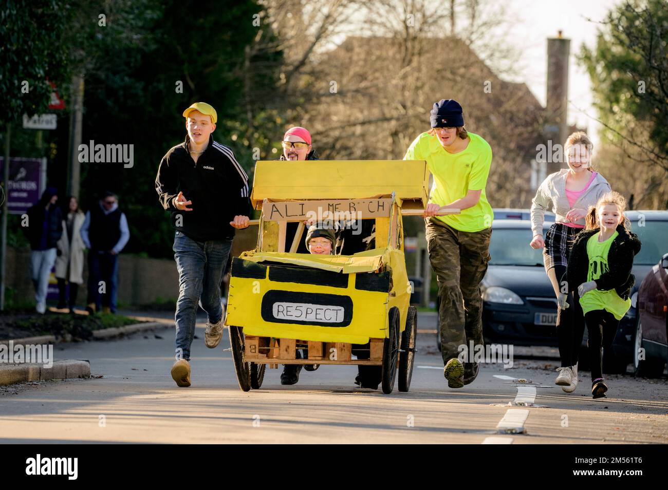 East Hoathly, UK. 26th Dec, 2022. Boxing Day pram race: Teams in fancy dress race through the village of East Hoathly in East Sussex raising funds for local charities. The annual event begins and ends at the Kings Head pub in the centre of the village. Credit: Jim Holden/Alamy Live News Stock Photo