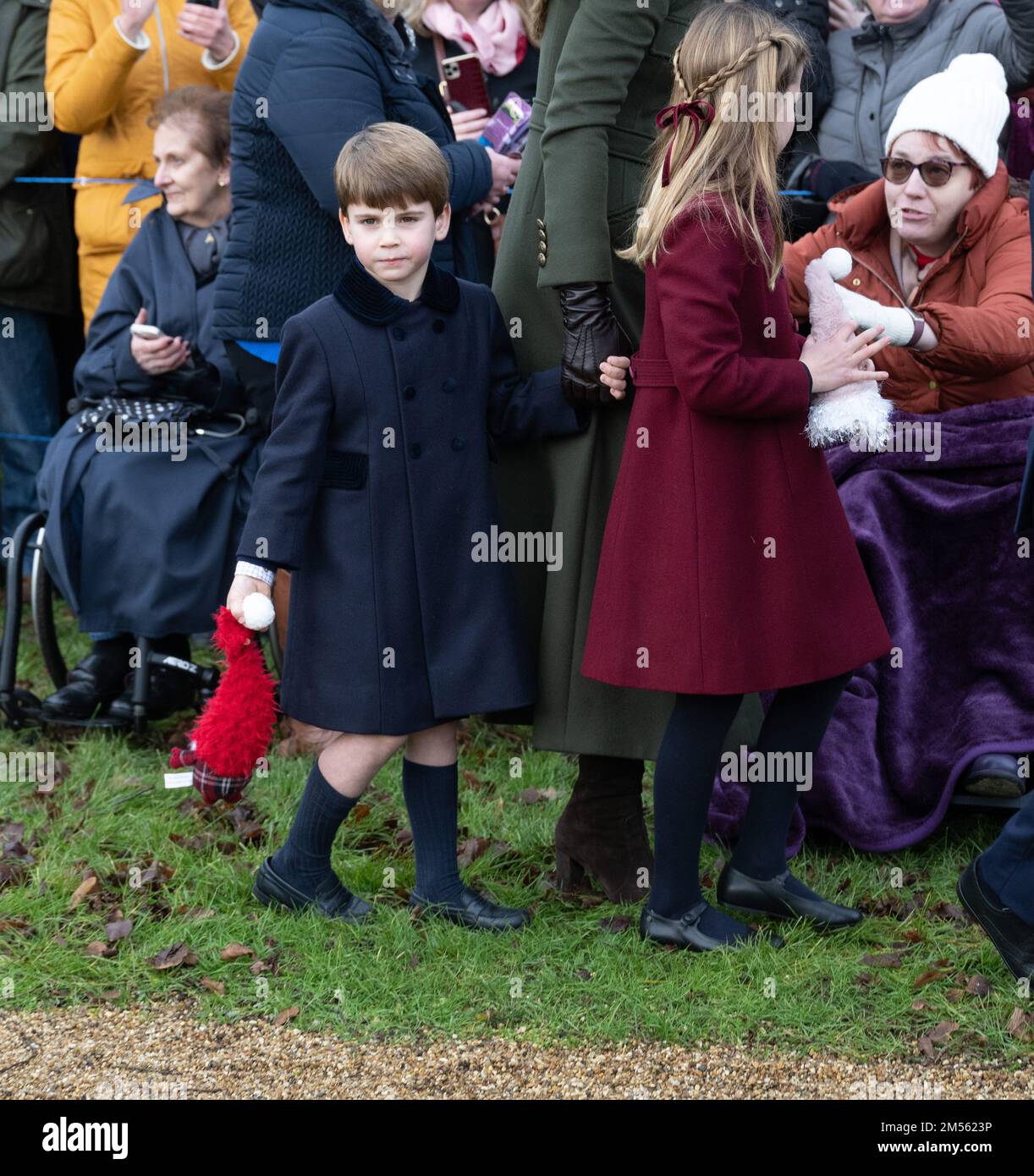 Sandringham, UK. 25 December, 2022.  Prince Louis and Princess Charlotte meet the public following the Christmas Day service at Sandringham Church. Stock Photo