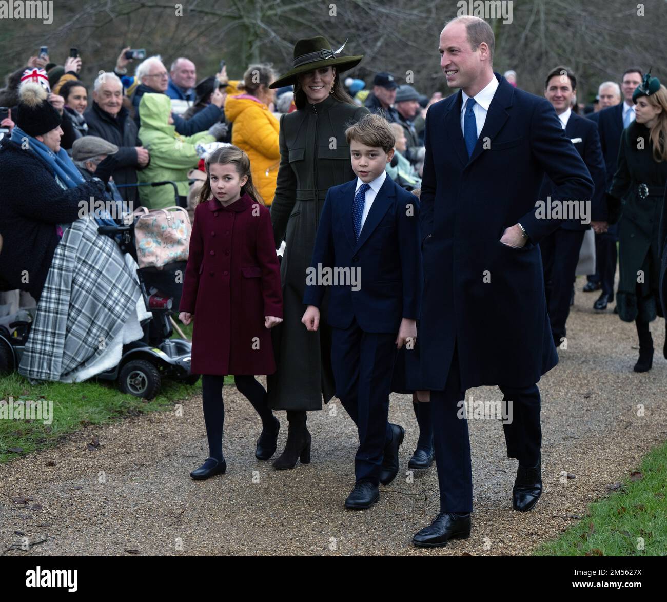 Sandringham, UK. 25 December, 2022.  Princess Charlotte, Catherine, Princess of Wales,  Prince George and Prince William, Prince of Wales attend the C Stock Photo