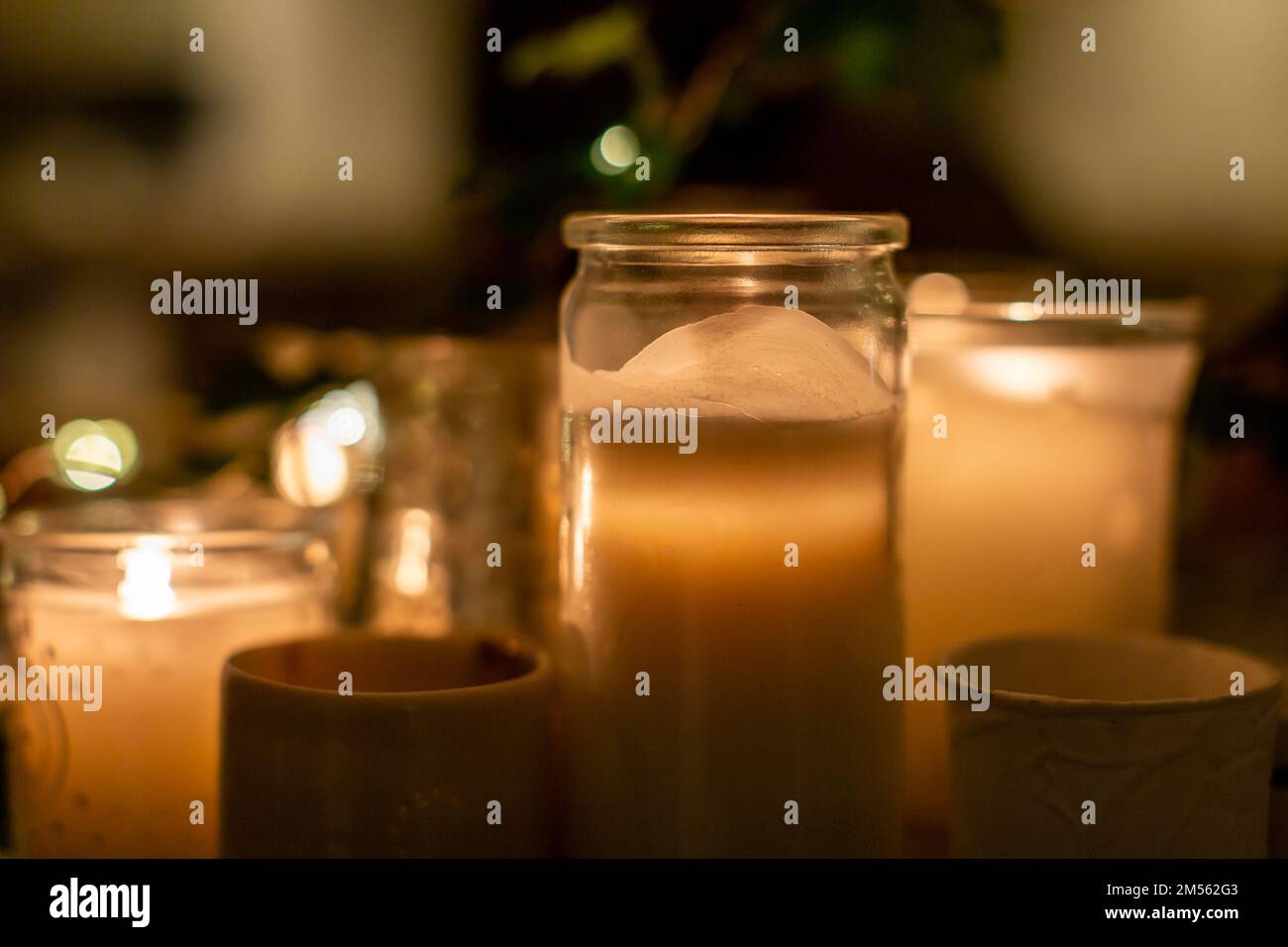 Pretty candles on a mantelpiece, with a shallow depth of field Stock