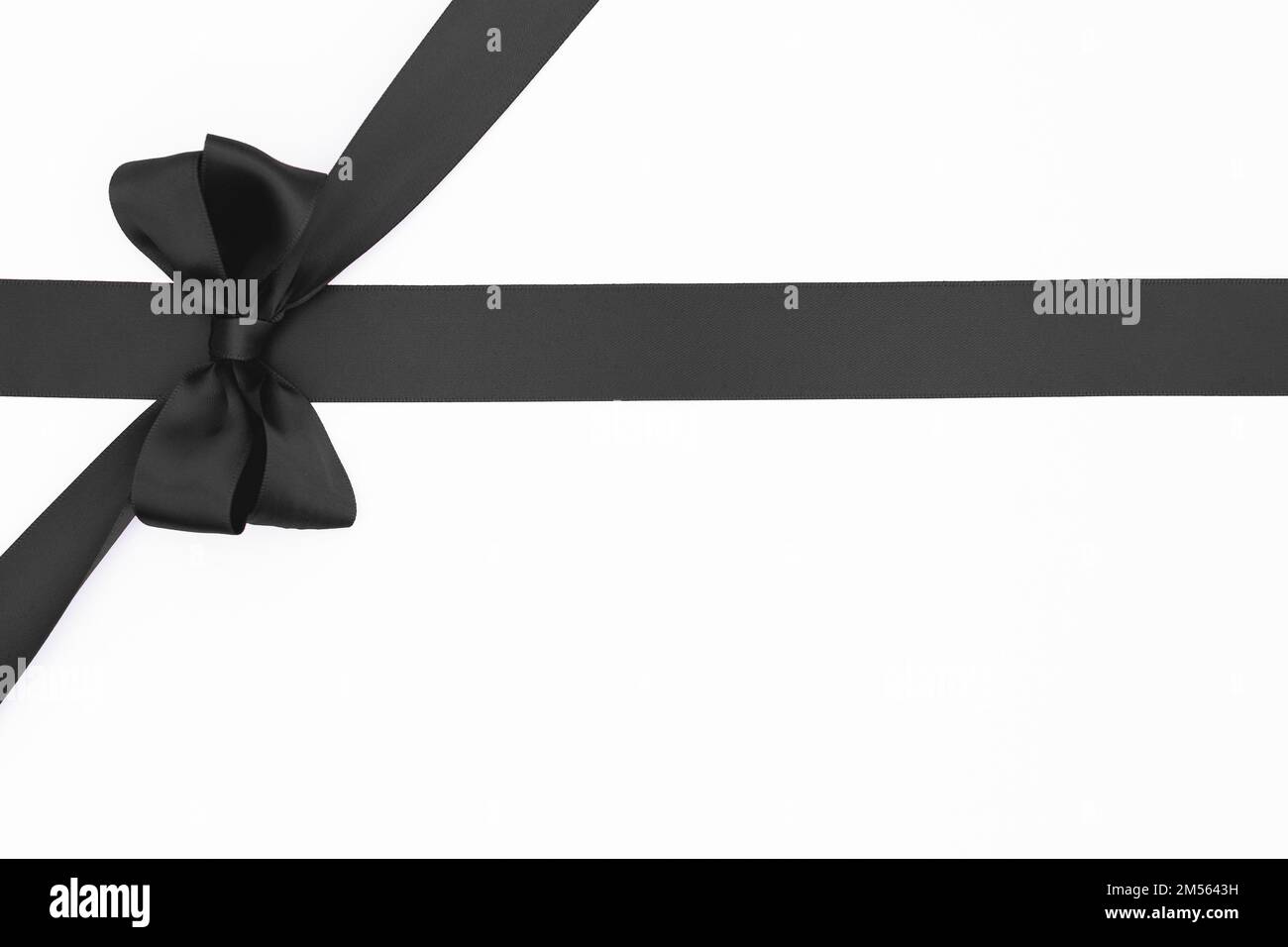 Satin ribbon bow for gift pack in black color, isolated on white ...