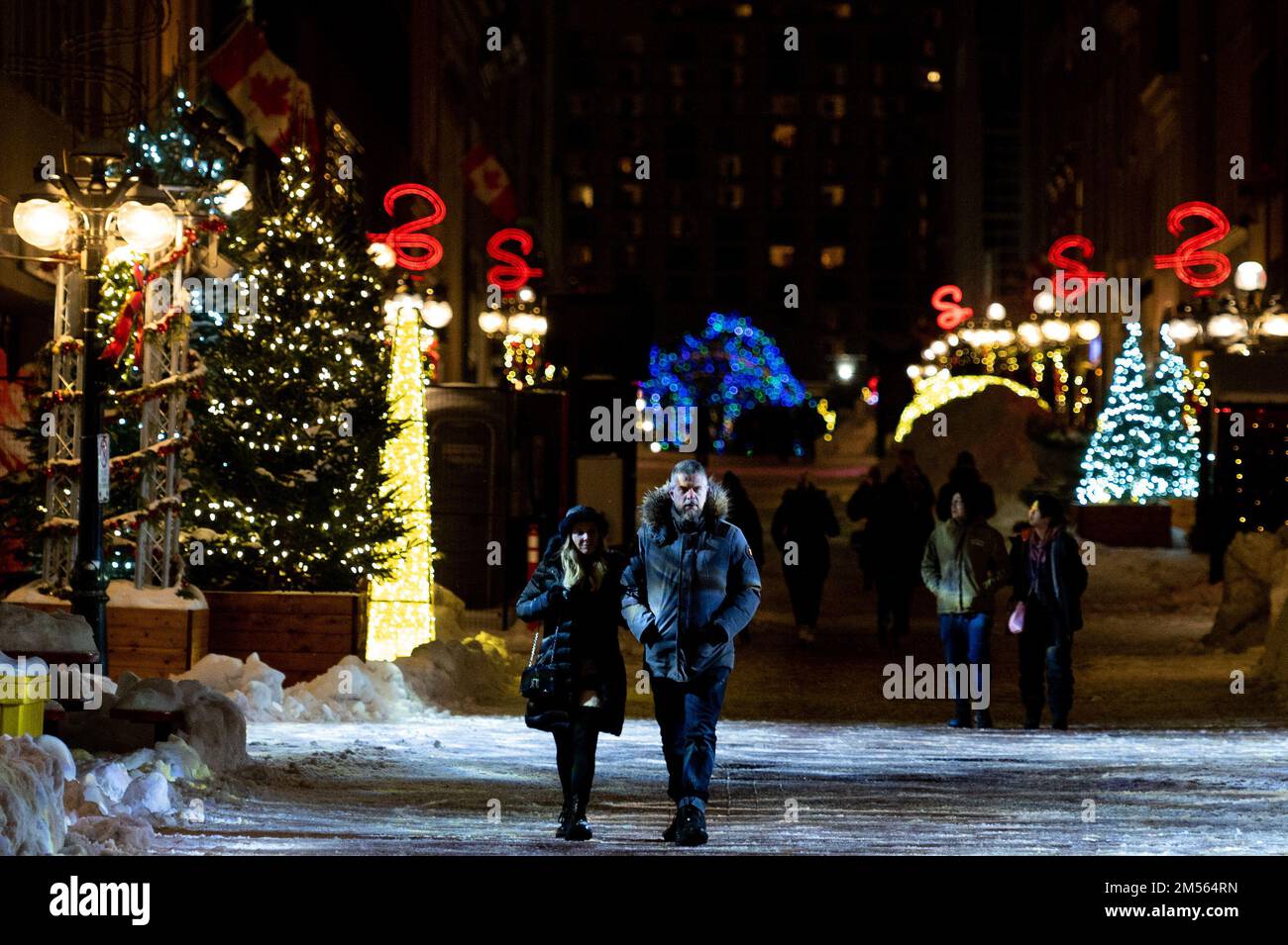 People walk along Sparks St. on Christmas Day in Ottawa, on Sunday, Dec