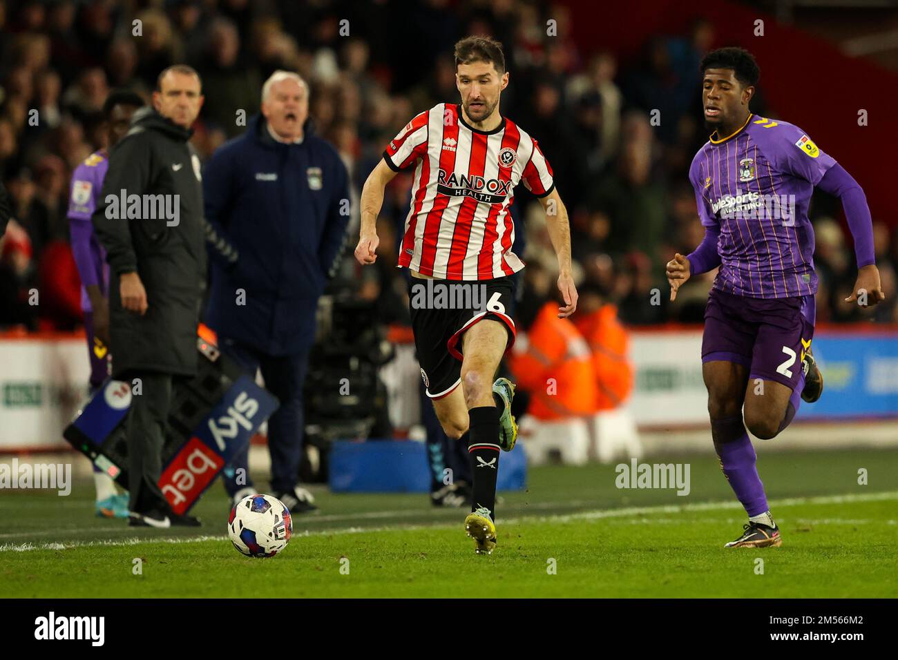 Sheffield, UK. 26th Dec, 2022. Chris Basham #6 of Sheffield United runs with the ball during the Sky Bet Championship match Sheffield United vs Coventry City at Bramall Lane, Sheffield, United Kingdom, 26th December 2022 (Photo by Nick Browning/News Images) in Sheffield, United Kingdom on 12/26/2022. (Photo by Nick Browning/News Images/Sipa USA) Credit: Sipa USA/Alamy Live News Stock Photo