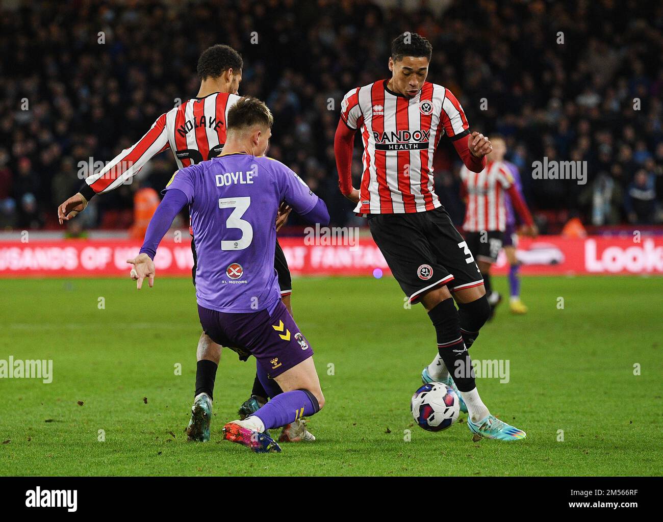 Sheffield, England, 26th December 2022.  Daniel Jebbison of Sheffield Utd faces Callum Doyle of Coventry City during the Sky Bet Championship match at Bramall Lane, Sheffield. Picture credit should read: Gary Oakley / Sportimage Credit: Sportimage/Alamy Live News Stock Photo