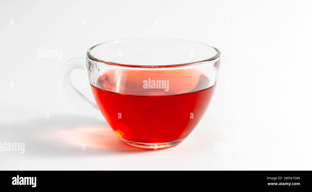 Glass cup with tea on a white background isolated. Stock Photo