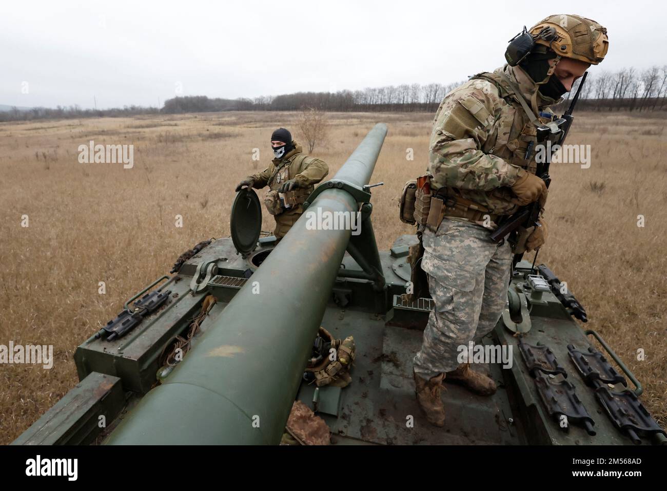 Ukrainian soldiers with the 43rd Heavy Artillery Brigade stand atop 2S7