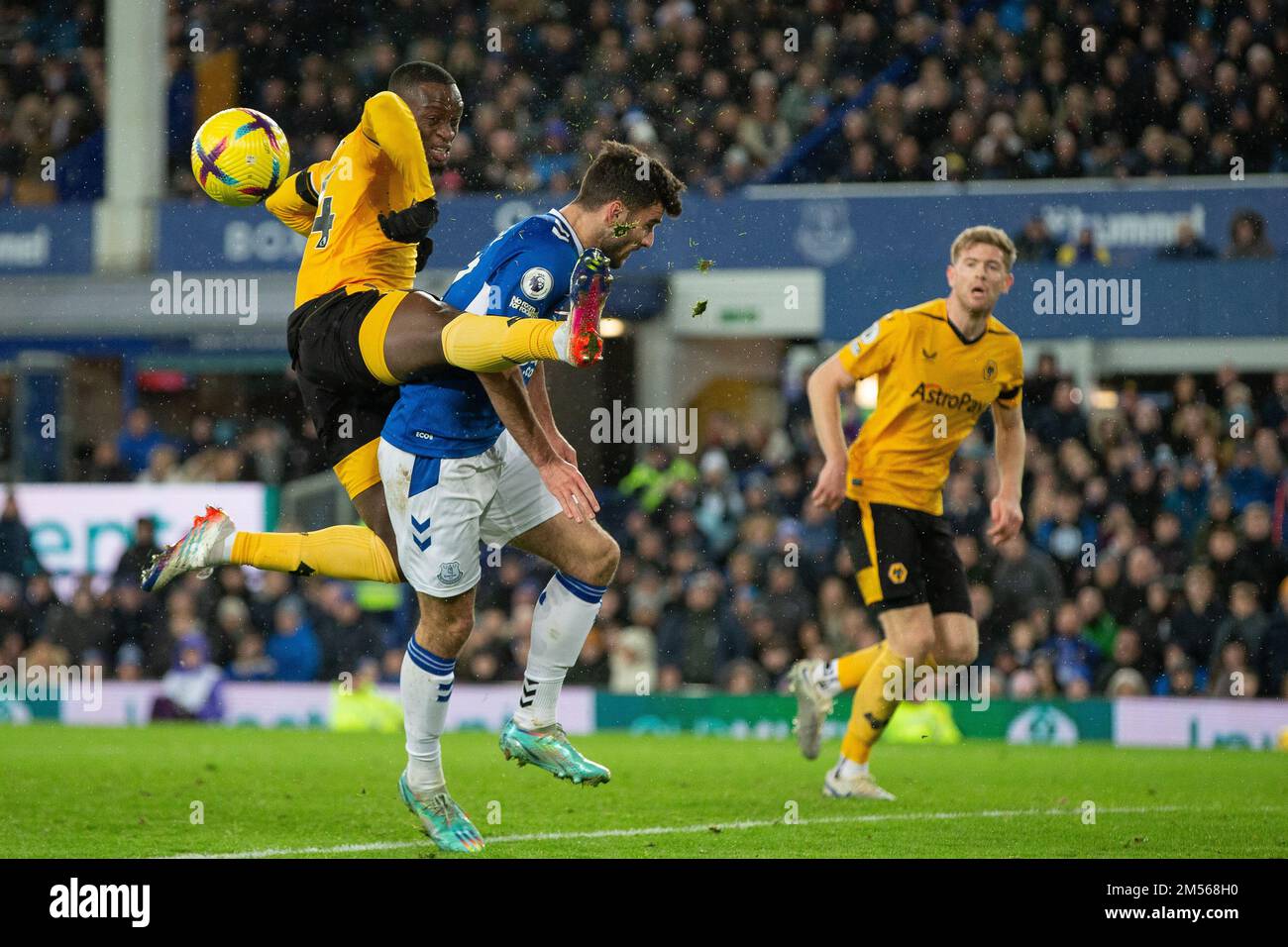 Toti Gomes #24 of Wolverhampton Wanderers comes close to Thomas Cannon #47 of Everton as he clears the ball during the Premier League match Everton vs Wolverhampton Wanderers at Goodison Park, Liverpool, United Kingdom, 26th December 2022  (Photo by Phil Bryan/News Images) Stock Photo