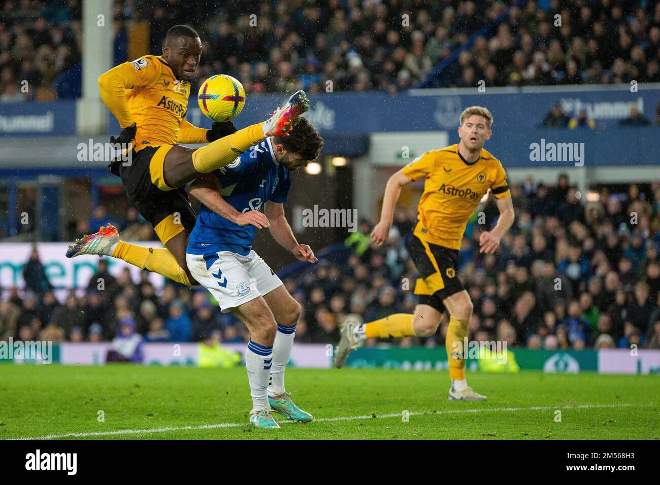 Toti Gomes #24 of Wolverhampton Wanderers comes close to Thomas Cannon #47 of Everton as he clears the ball during the Premier League match Everton vs Wolverhampton Wanderers at Goodison Park, Liverpool, United Kingdom, 26th December 2022  (Photo by Phil Bryan/News Images) Stock Photo