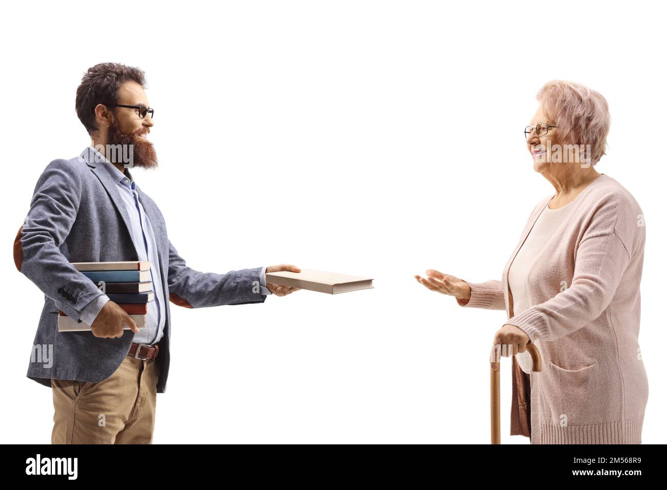 Profile shot of a man giving a book to an elderly woman isolated on white background Stock Photo