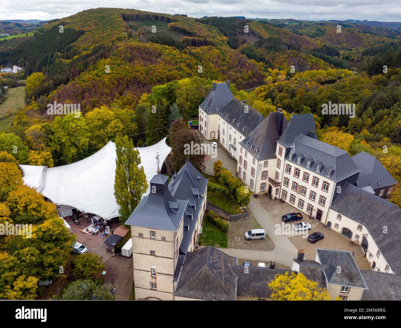Aerial Drone Shot in Wiltz Luxembourg. View on a Castle at cloudy