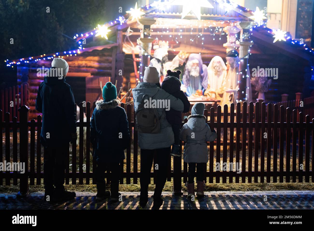 Family against scene where the Virgin Mary gave birth to Jesus and he