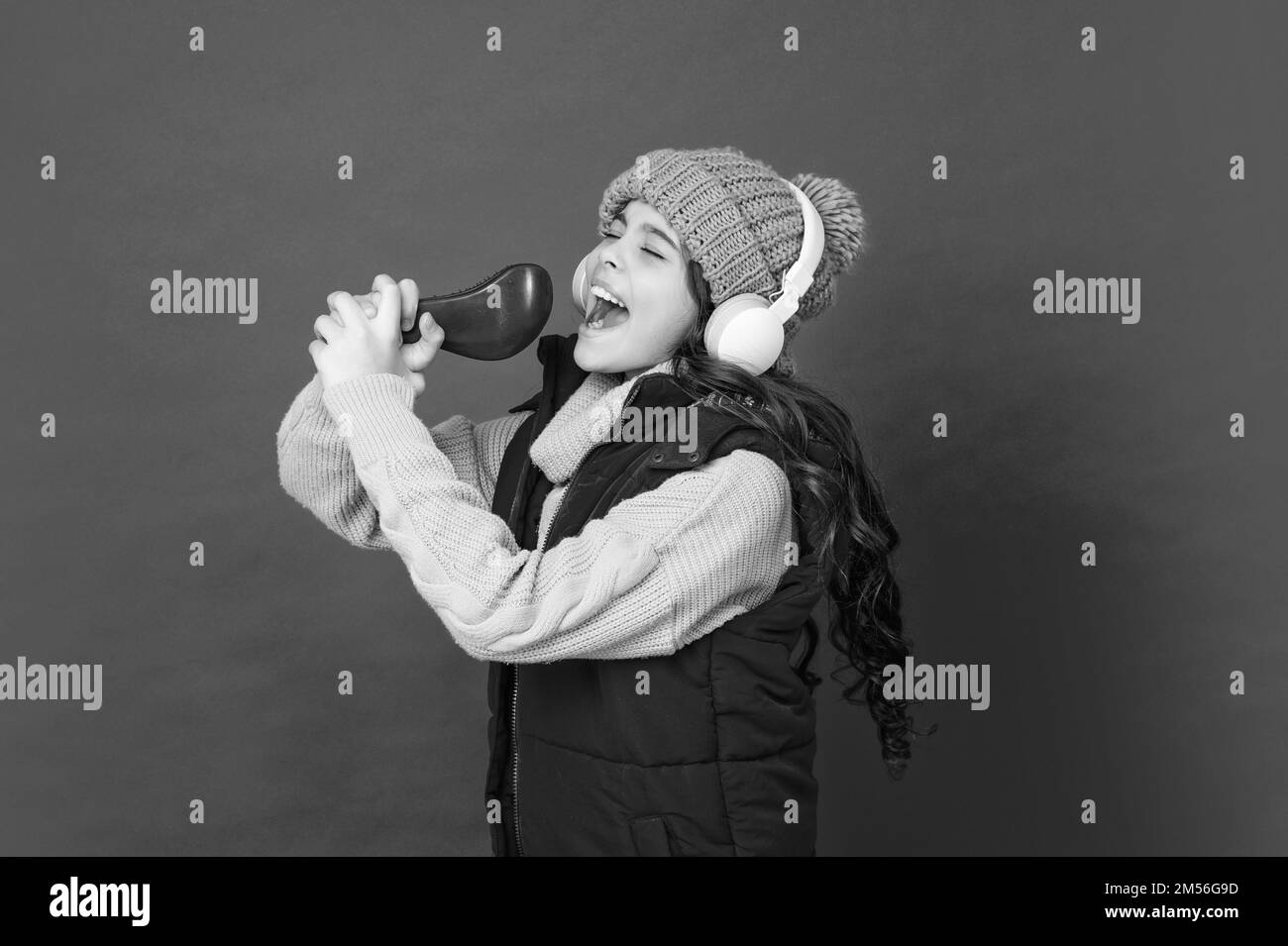 Teen home singing karaoke Black and White Stock Photos & Images - Alamy