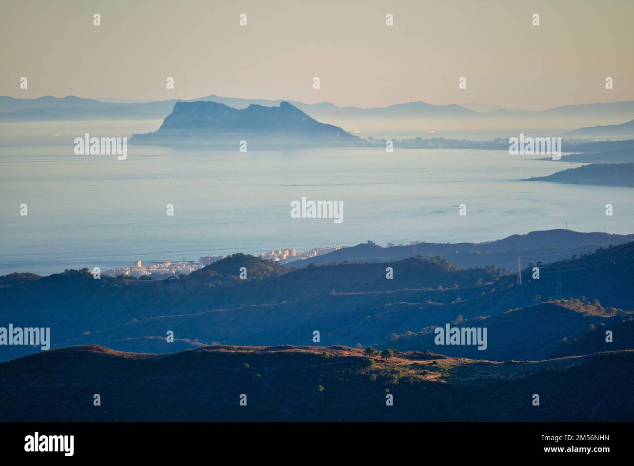 The Rock of Gibraltar seen from Spain with the coastline of Morocco, Africa, behind.  Two continents in one picture, the European continent and Africa Stock Photo