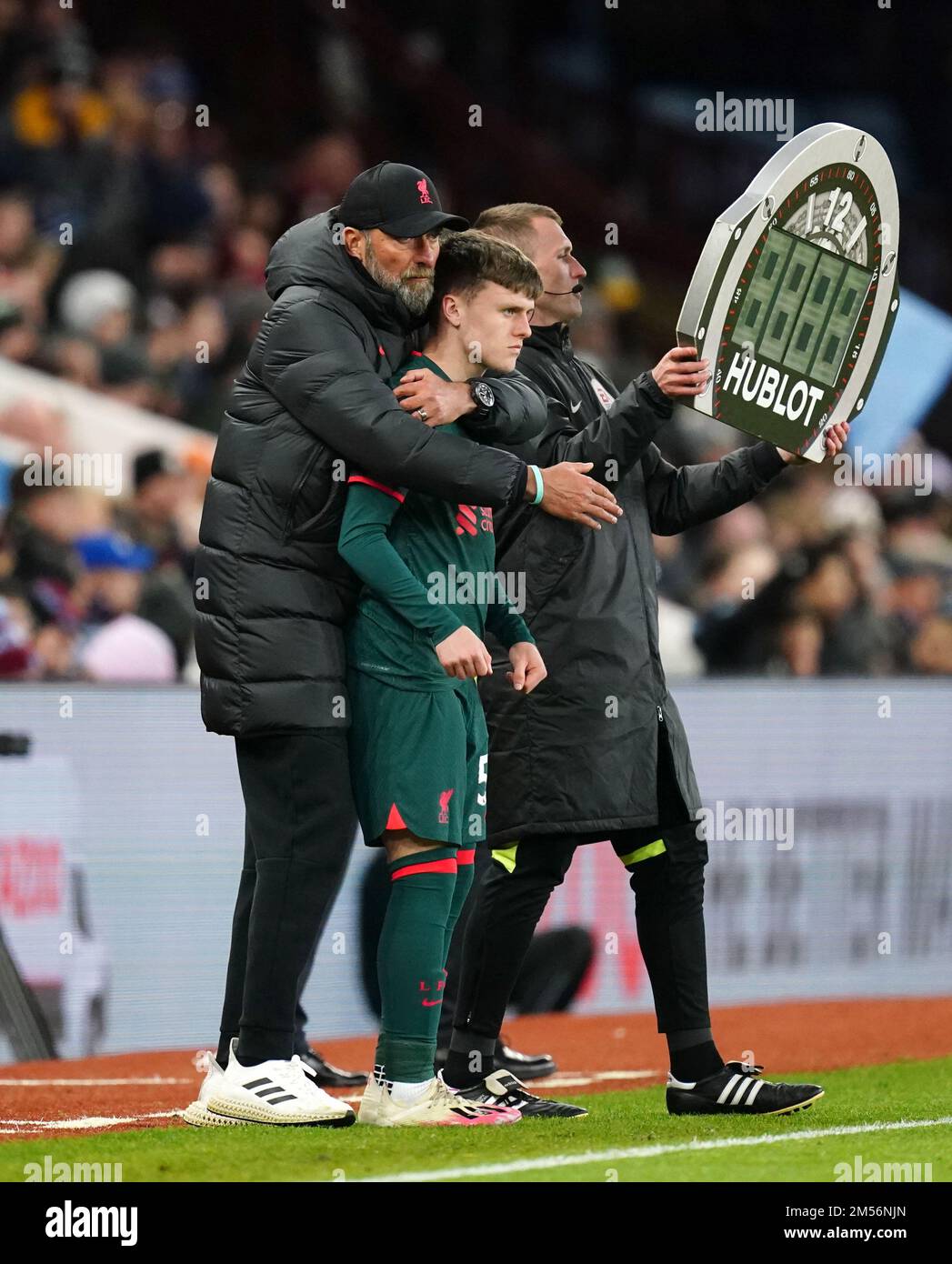Liverpool manager Jurgen Klopp embraces substitute Ben Doak on the ...