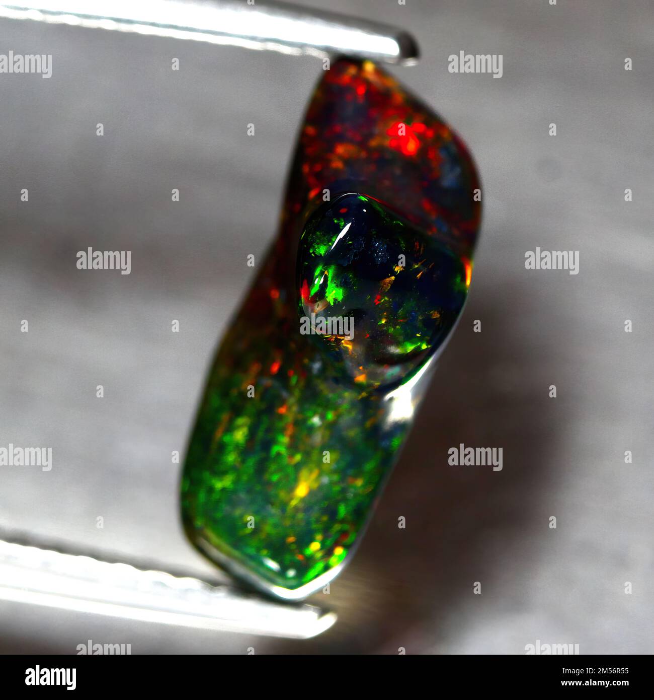 Natural beautiful stone opal on gray background Stock Photo
