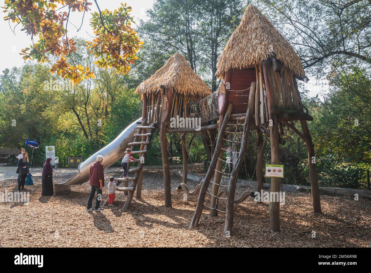 Parents play with their children at the playground at Ljubljana Zoo Stock Photo Alamy