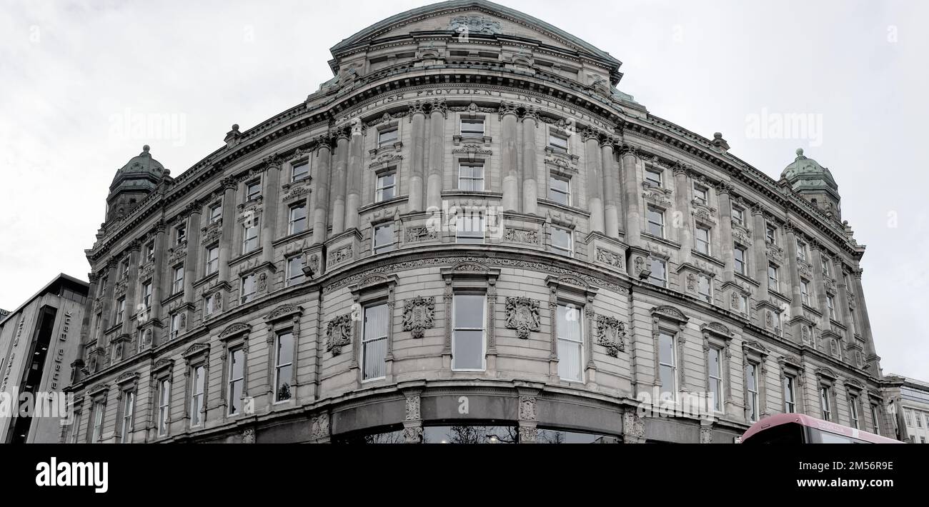 A panoramic low angle shot of an old building with complex ...