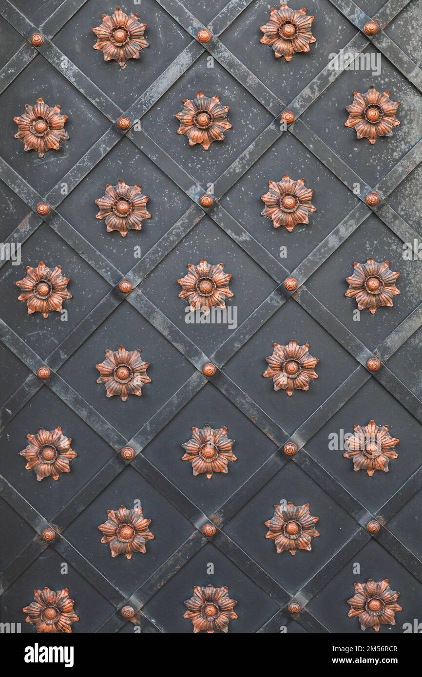 background of ancient metal forged doors in the castle Stock Photo