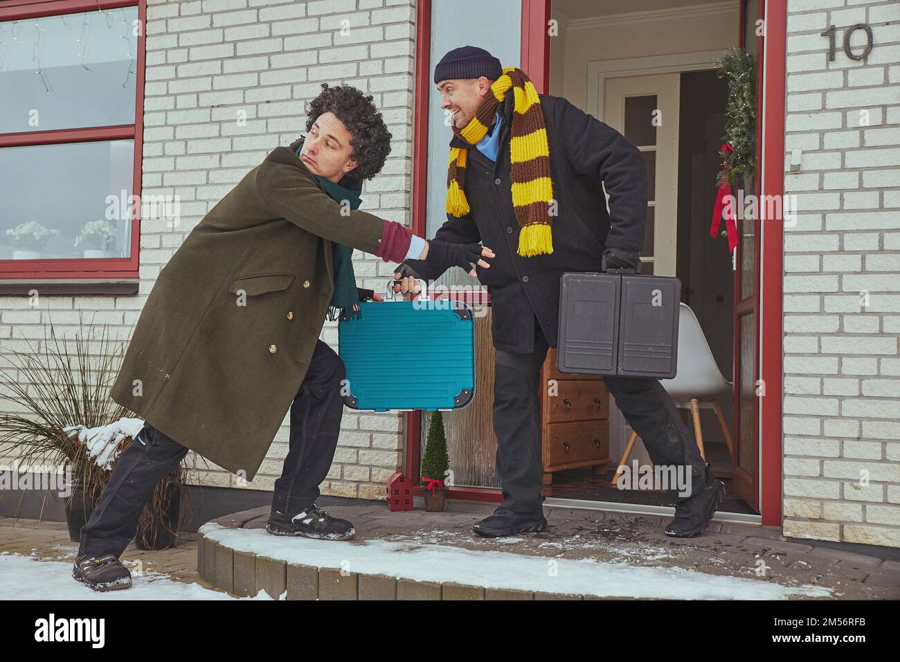 Skive, Denmark, December 2022: Delivery workers pretend to be robbers Stock Photo