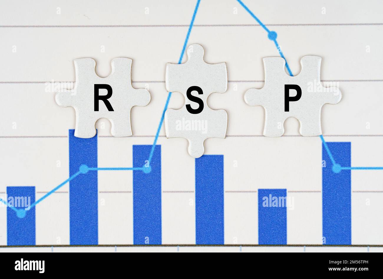 Business concept. On business reports - diagrams are puzzles with the inscription - RSP Stock Photo