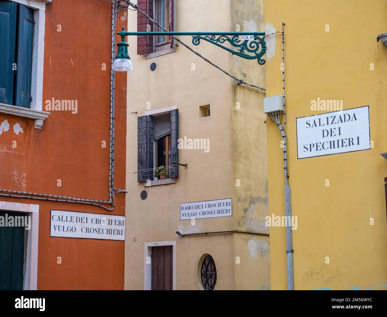 Typical alleyway of Venice with the names of the roads on the wall Stock Photo Alamy