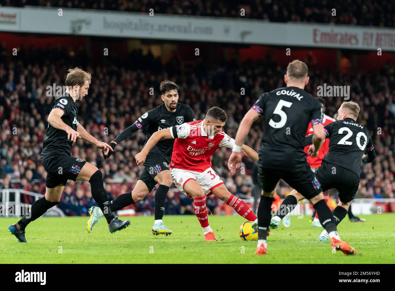 Granit Xhaka #34 of Arsenal looks for a way through the West Ham defence during the Premier League match Arsenal vs West Ham United at Emirates Stadium, London, United Kingdom, 26th December 2022  (Photo by Richard Washbrooke/News Images) Stock Photo