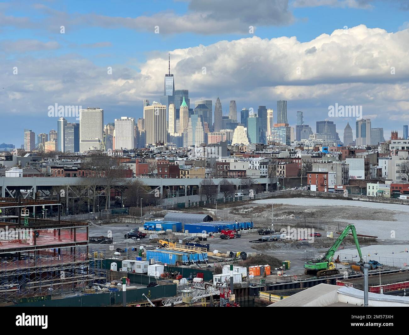 Lower Manhattan skyline shooting up behind Brooklyn neighborhoods in the foreground. Stock Photo