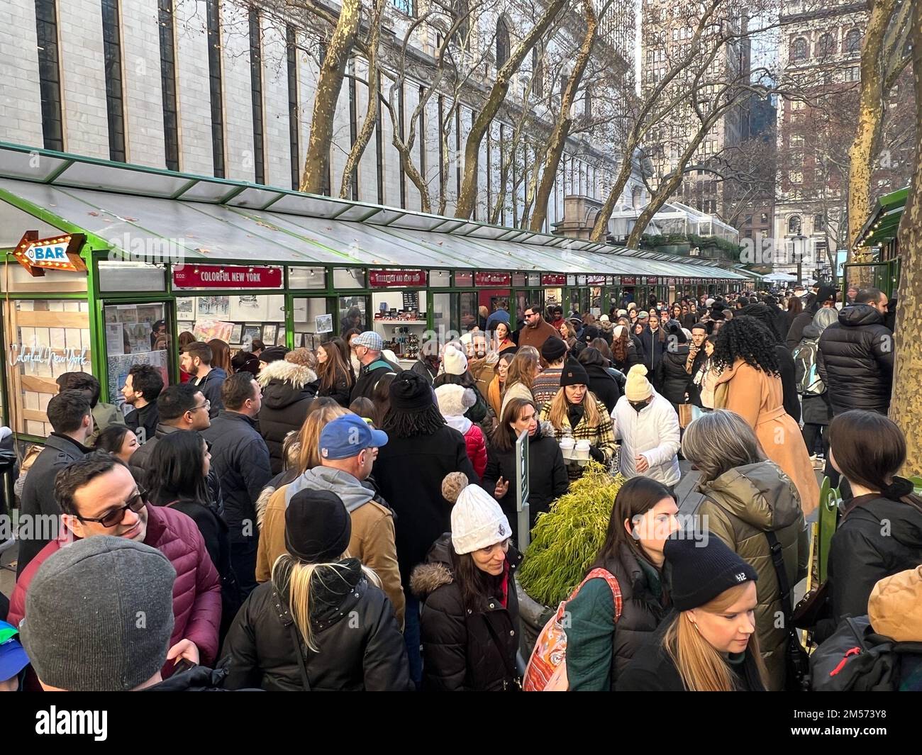 Crowds of people at the holiday shopping village at Bryant Park a week ...