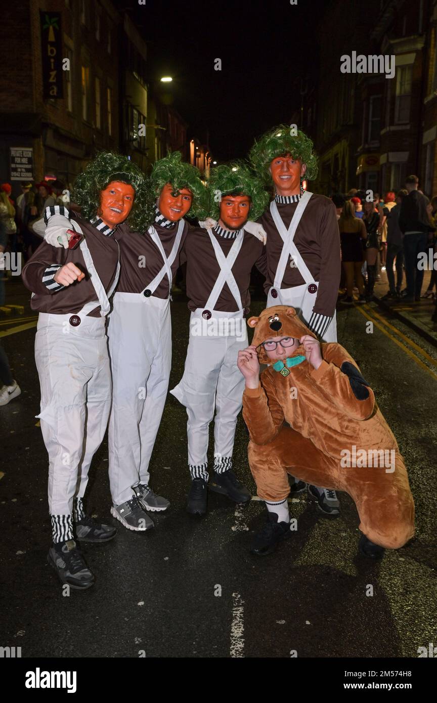 King Street Wigan December 26th 2022. Revellers in various fancy dress outfits from traffic cones to Beetlejuice to sexy Peaky Blinders have hit the streets of Wigan on Boxing Day evening
